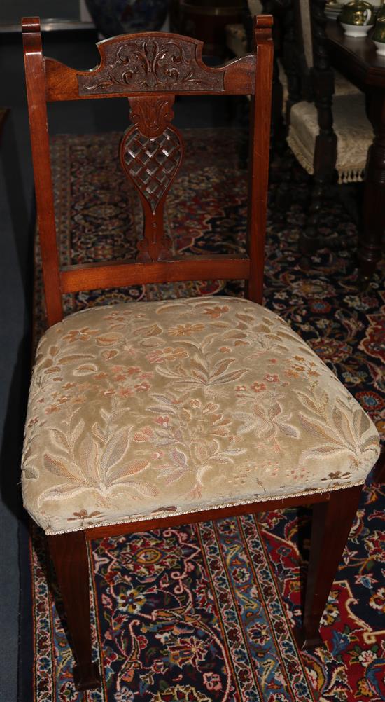 A set of four Edwardian walnut dining chairs